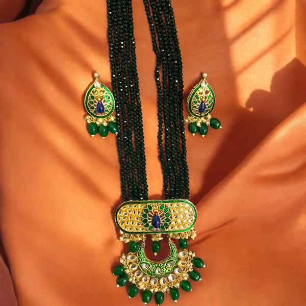 Green long necklace set with peacock motif and Kundan stones | Indian Jewelry | South Asian Jewelry | Traditional green necklace with intricate peacock design | Includes matching earrings | Perfect for weddings, festivals, and special occasions |