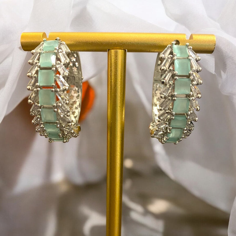 Gold-plated mint AD hoop earrings featuring sparkling American diamonds and delicate mint stones, perfect for weddings, festive celebrations, and everyday wear. Lightweight, elegant, and versatile South Asian jewelry for women.