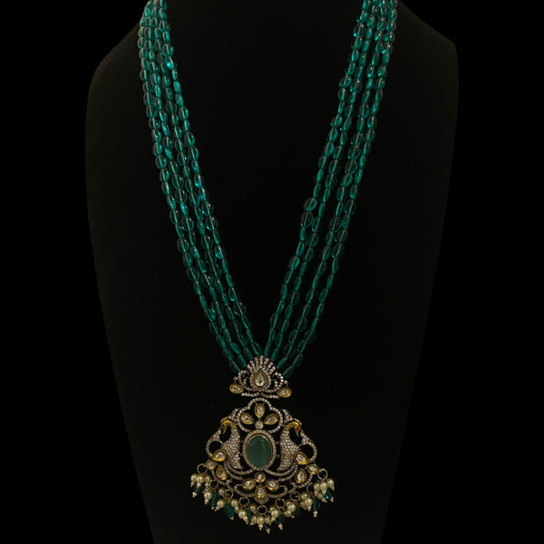 Seagreen bead long mala necklace set with silver foil Kundan and cubic zirconia in Victorian (Mangat Rai) finish | South Asian jewelry | Features dual peacock motifs with turquoise stone center | Includes matching earrings |