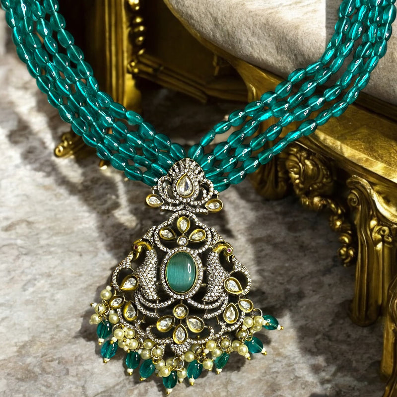 Long mala necklace with seagreen beads, silver foil Kundan, and cubic zirconia in Victorian finish | Mangat Rai style | South Asian jewelry | Dual peacock motifs with turquoise stone center | Includes matching earrings | Timeless traditional jewelryl