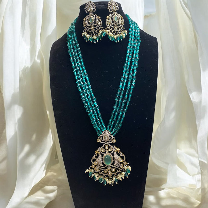 Seagreen bead long mala necklace set with silver foil Kundan and cubic zirconia in Mangat Rai finish | South Asian jewelry with Victorian elegance | Dual peacock motifs and turquoise center stone | Includes matching earrings |