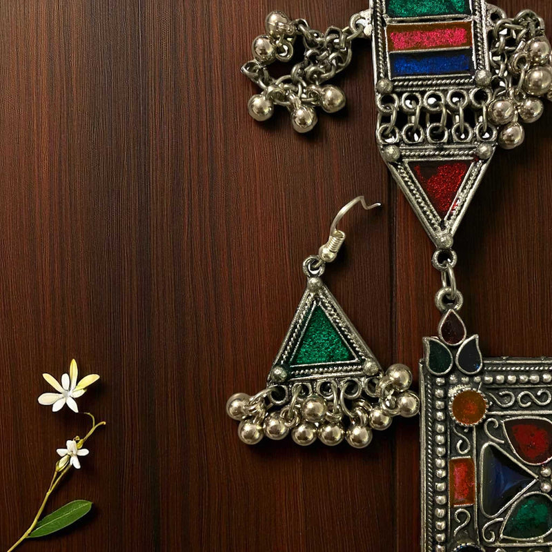 Handcrafted Aradhya German Silver Multicolor Ghungroo Earrings featuring oxidized silver finish, colorful enamel detailing, and dangling ghungroos. These tribal boho earrings blend traditional Indian artistry with modern elegance. Perfect ethnic statement jewelry for festivals, weddings, and parties. Lightweight, vibrant, and ideal to pair with sarees, lehengas, or Indo-western outfits.